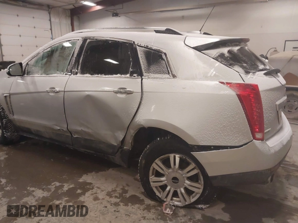 2016 Cadillac SRX Luxury Collection z VIN 3GYFNBE36GS572780, wystawiony jako IAAI lot #41347399 z przebiegiem 166 436 mil mil oraz . Historia ofert i sprzedaży dostępna na DreamBid. Obrazek 6.