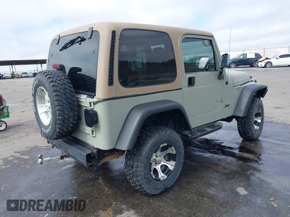 1999 Jeep Wrangler Sahara with VIN 1J4FY49S0XP480017, listed as a IAAI auction lot 41642577 with 154,068 mi miles. Bid and sale history available at carsss.com. Image 4.