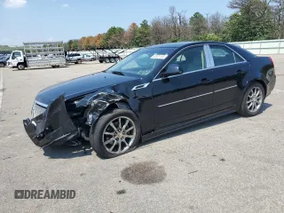 2011 Cadillac CTS Performance with VIN 1G6DJ5ED7B0162298, listed as a Copart auction lot 63301135 with 56,573 mi miles and Salvage title. Bid and sale history available at DreamBid. Image 1.