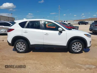 2016 Mazda CX-5 Touring z VIN JM3KE2CY0G0840918, wystawiony jako IAAI lot #42205529 z przebiegiem 74 515 mil mil oraz . Historia ofert i sprzedaży dostępna na DreamBid. Obrazek 13.