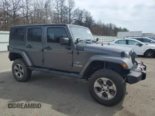 2018 Jeep Wrangler Unlimited Sahara with VIN 1C4BJWEG7JL856331, listed as a Copart auction lot 50246135 with 101,014 mi miles and Salvage title. Bid and sale history available at DreamBid. Image 4.