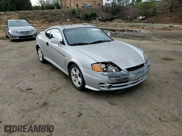 2003 Hyundai Tiburon GT z VIN KMHHN65F13U013420, wystawiony jako Copart lot #51234495 z przebiegiem 230 612 mil mil oraz Szkoda całkowita • Salvage title. Historia ofert i sprzedaży dostępna na DreamBid. Obrazek 11.