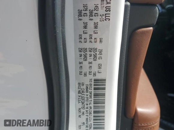 2015 Jeep Grand Cherokee Summit with VIN 1C4RJFJG3FC847797, listed as a Copart auction lot 54848085 with 53,506 mi miles and Salvage Title. Bid and sale history available at DreamBid. Image 13.