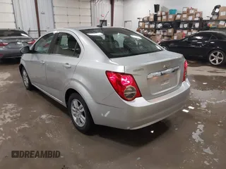 2014 Chevrolet Sonic LT with VIN 1G1JC5SG8E4107664, listed as a IAAI auction lot 41614306 with 128,946 mi miles and . Bid and sale history available at DreamBid. Image 3.