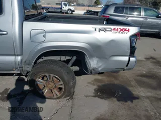 2018 Toyota Tacoma SR with VIN 3TMCZ5AN6JM185891, listed as a IAAI auction lot 41450665 with 53,749 mi miles and . Bid and sale history available at DreamBid. Image 6.