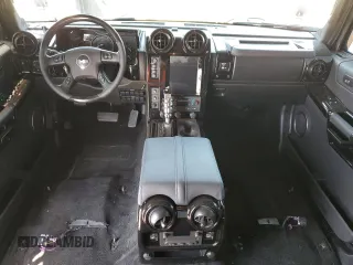 2005 Hummer H2 SUV z VIN 5GRGN23U05H117630, wystawiony jako Copart lot #57087305 z przebiegiem 60 260 mil mil oraz Szkoda całkowita • Salvage title. Historia ofert i sprzedaży dostępna na DreamBid. Obrazek 8.