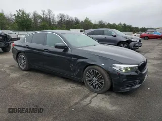 2019 BMW 5 Series 540i xDrive with VIN WBAJE7C54KWW19994, listed as a Copart auction lot 57973055 with 121,995 mi miles and Salvage title. Bid and sale history available at DreamBid. Image 4.