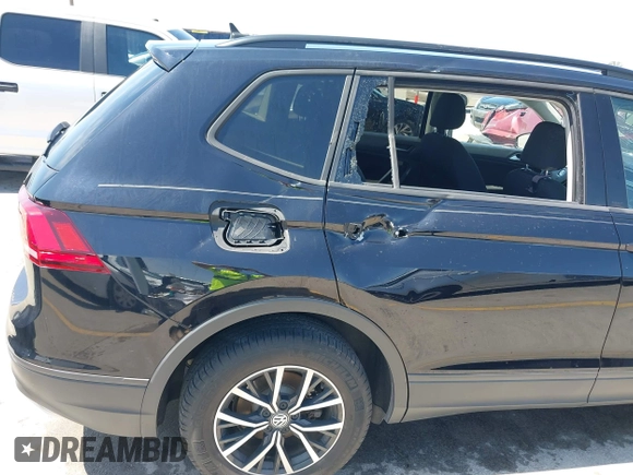 2021 Volkswagen Tiguan S with VIN 3VV1B7AX9MM067347, listed as a IAAI auction lot 42305101 with 77,042 mi miles and . Bid and sale history available at DreamBid. Image 6.