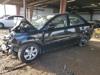 2010 Kia Rio LX with VIN KNADH4A34A6682936, listed as a Copart auction lot 82431724 with 84,528 mi miles and Salvage Title. Bid and sale history available at carsss.com. Image 1.