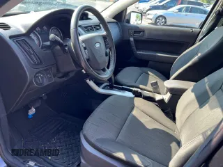 2008 Ford Focus SE with VIN 1FAHP35N28W24058, listed as a Copart auction lot 66020775 with 164,683 mi miles and Clean title. Bid and sale history available at DreamBid. Image 7.