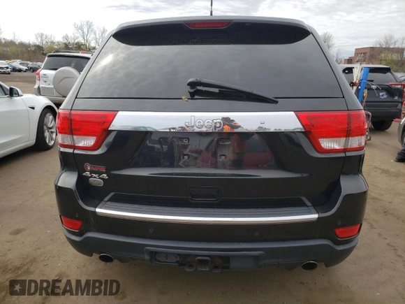 2011 Jeep Grand Cherokee Overland with VIN 1J4RR6GT9BC660730, listed as a Copart auction lot 53770745 with 106,351 mi miles and Salvage title. Bid and sale history available at DreamBid. Image 6.