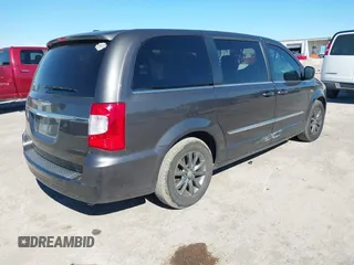 2016 Chrysler Town & Country S with VIN 2C4RC1HG9GR128212, listed as a IAAI auction lot 40858279 with 169,433 mi miles. Bid and sale history available at carsss.com. Image 4.