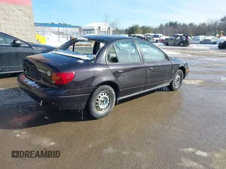 2000 Saturn SL z VIN 1G8ZH5280YZ223608, wystawiony jako IAAI lot #41377752 z przebiegiem 180 857 mil mil oraz . Historia ofert i sprzedaży dostępna na DreamBid. Obrazek 4.