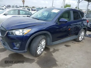 2014 Mazda CX-5 Grand Touring with VIN JM3KE2DY1E0307911, listed as a IAAI auction lot 42064898 with 133,934 mi miles. Bid and sale history available at carsss.com. Image 2.