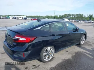 2021 Honda Clarity Touring z VIN JHMZC5F3XMC001253, wystawiony jako IAAI lot #42212102 z przebiegiem 35 649 mil mil oraz . Historia ofert i sprzedaży dostępna na DreamBid. Obrazek 4.
