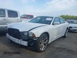 2014 Dodge Charger SXT with VIN 2C3CDXHG4EH337807, listed as a IAAI auction lot 42027319 with 151,988 mi miles. Bid and sale history available at carsss.com. Image 2.