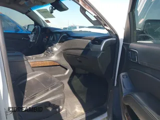 2019 Chevrolet Suburban LT with VIN 1GNSCHKC3KR143942, listed as a IAAI auction lot 41896633 with 153,139 mi miles and . Bid and sale history available at DreamBid. Image 5.