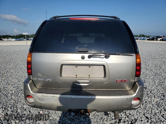 2003 GMC Envoy SLT z VIN 1GKDS13S032373020, wystawiony jako Copart lot #54986765 z przebiegiem 235 711 mil mil oraz Tytuł czysty. Historia ofert i sprzedaży dostępna na DreamBid. Obrazek 6.
