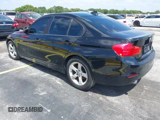 2014 BMW 3 Series 320i with VIN WBA3B1C55EK135357, listed as a IAAI auction lot 42158550 with 148,911 mi miles. Bid and sale history available at carsss.com. Image 3.