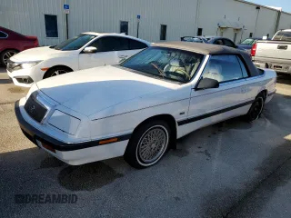 1990 Chrysler LeBaron z VIN 1C3XJ4533LG472070, wystawiony jako Copart lot #74314104 z przebiegiem 97 354 mil mil oraz Szkody całkowita. Historia ofert i sprzedaży dostępna na DreamBid. Obrazek 1.