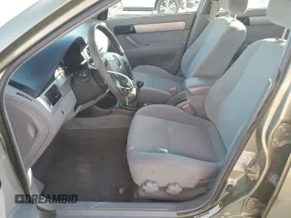 2006 Suzuki Forenza z VIN KL5JD56Z26K261080, wystawiony jako Copart lot #87112194 z przebiegiem 191 049 mil mil oraz Szkody całkowita. Historia ofert i sprzedaży dostępna na DreamBid. Obrazek 7.