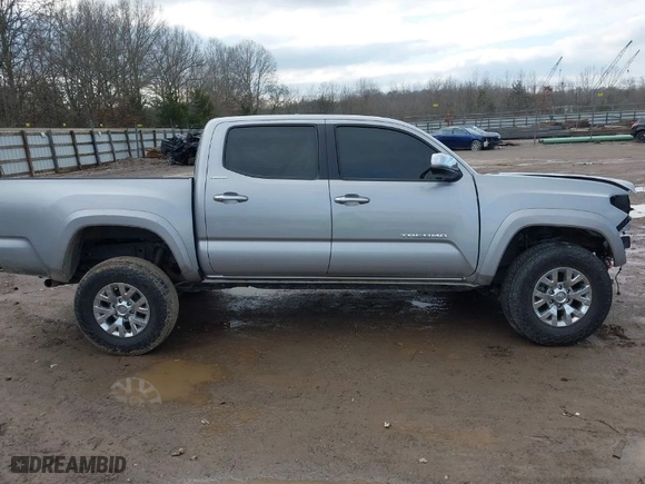 2019 Toyota Tacoma 4WD SR with VIN 3TMGZ5AN8KM259475, listed as a IAAI auction lot 41569810 with 61,405 mi miles. Bid and sale history available at carsss.com. Image 13.