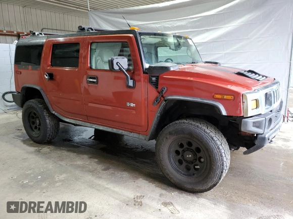 2003 Hummer H2 z VIN 5GRGN23U93H138182, wystawiony jako Copart lot #51842085 z przebiegiem 170 659 mil mil oraz Tytuł czysty. Historia ofert i sprzedaży dostępna na DreamBid. Obrazek 4.