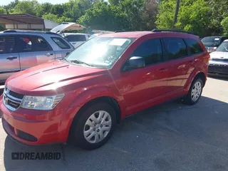 2015 Dodge Journey SE z VIN 3C4PDCAB5FT679585, wystawiony jako IAAI lot #42090600 z przebiegiem 166 876 mil mil oraz . Historia ofert i sprzedaży dostępna na DreamBid. Obrazek 2.