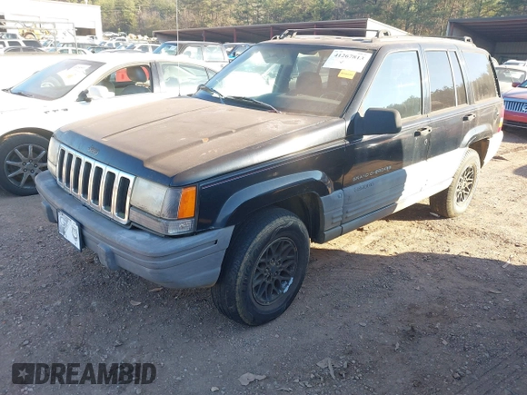 1998 Jeep Grand Cherokee Laredo with VIN 1J4FX58S7WC283734, listed as a IAAI auction lot 41267813 with 266,189 mi miles. Bid and sale history available at carsss.com. Image 2.