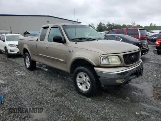 2002 Ford F-150 XL with VIN 1FTRX18L02NA58574, listed as a Copart auction lot 57156255 with 291,950 mi miles and Salvage title. Bid and sale history available at DreamBid. Image 4.