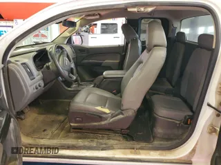 2015 GMC Canyon z VIN 1GTH6AE33F1229463, wystawiony jako IAAI lot #42399992 z przebiegiem 123 157 mil mil oraz . Historia ofert i sprzedaży dostępna na DreamBid. Obrazek 8.