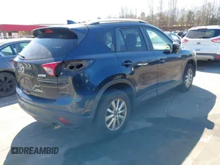 2016 Mazda CX-5 Touring with VIN JM3KE4CY0G0631786, listed as a IAAI auction lot 41761214 with 220,058 mi miles. Bid and sale history available at carsss.com. Image 4.