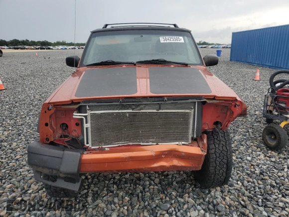 1999 Jeep Cherokee Sport with VIN 1J4FF68S7XL560943, listed as a Copart auction lot 58425505 with 68,654 mi miles and Salvage title. Bid and sale history available at DreamBid. Image 5.