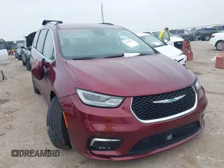 2021 Chrysler Pacifica Hybrid Touring L with VIN 2C4RC1L7XMR599210, listed as a IAAI auction lot 42300271 with 82,158 mi miles and . Bid and sale history available at DreamBid. Image 1.