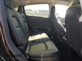 2023 Tesla Model Y Long Range z VIN 7SAYGAEE7PF859030, wystawiony jako Copart lot #58965185 z przebiegiem 18 421 mil mil oraz Czysty tytuł • Clean title. Historia ofert i sprzedaży dostępna na DreamBid. Obrazek 10.