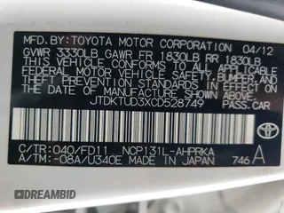 2012 Toyota Yaris L z VIN JTDKTUD3XCD528749, wystawiony jako Copart lot #56803205 z przebiegiem 140 024 mil mil oraz Szkoda całkowita • Salvage title. Historia ofert i sprzedaży dostępna na DreamBid. Obrazek 12.