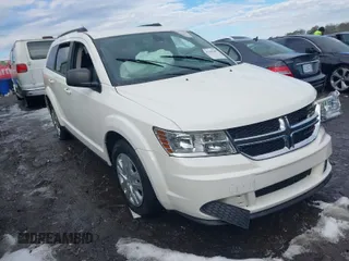 2018 Dodge Journey SE with VIN 3C4PDCAB1JT295988, listed as a IAAI auction lot 41226385 with 106,639 mi miles. Bid and sale history available at carsss.com. Image 1.