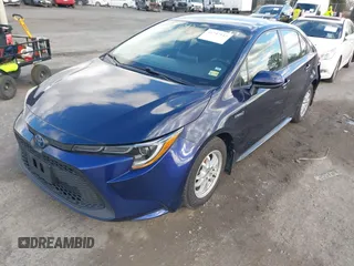 2021 Toyota Corolla Hybrid LE with VIN JTDEAMDE9MJ021431, listed as a IAAI auction lot 41747142 with 165,680 mi miles. Bid and sale history available at carsss.com. Image 2.