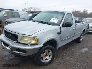 1998 Ford F-150 Standard with VIN 1FTZF18W2WNC27724, listed as a IAAI auction lot 41501654 with 336,342 mi miles. Bid and sale history available at carsss.com. Image 2.