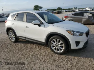 2014 Mazda CX-5 Grand Touring with VIN JM3KE4DYXE0377810, listed as a Copart auction lot 53071255 with 117,642 mi miles and Salvage Title. Bid and sale history available at DreamBid. Image 4.