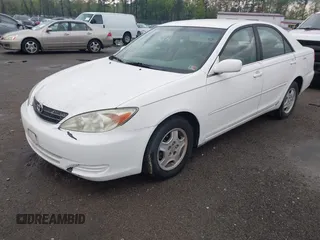 2003 Toyota Camry LE z VIN 4T1BF30K93U044730, wystawiony jako IAAI lot #42044599 z przebiegiem 120 401 mil mil oraz . Historia ofert i sprzedaży dostępna na DreamBid. Obrazek 2.