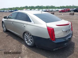 2014 Cadillac XTS Luxury z VIN 2G61M5S38E9291182, wystawiony jako IAAI lot #42495838 z przebiegiem 104 941 mil mil oraz . Historia ofert i sprzedaży dostępna na DreamBid. Obrazek 3.
