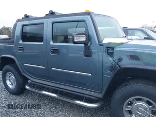 2005 Hummer H2 SUT with VIN 5GRGN22U15H114401, listed as a IAAI auction lot 41268764 with 166,651 mi miles. Bid and sale history available at carsss.com. Image 13.