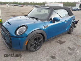2022 MINI Convertible Cooper S z VIN WMW43DL06N3P19784, wystawiony jako IAAI lot #42635816 z przebiegiem 17 053 mil mil oraz . Historia ofert i sprzedaży dostępna na DreamBid. Obrazek 18.