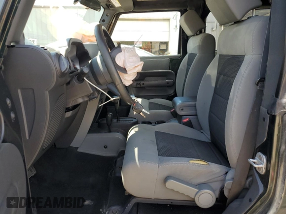 2010 Jeep Wrangler Rubicon with VIN 1J4BA6D12AL221220, listed as a Copart auction lot 56057055 with 200,346 mi miles and Salvage title. Bid and sale history available at DreamBid. Image 7.