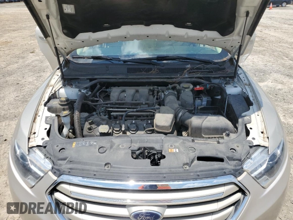 2017 Ford Taurus Limited z VIN 1FAHP2F84HG128211, wystawiony jako Copart lot #62262145 z przebiegiem Nie podano mil oraz Czysty tytuł • Clean title. Historia ofert i sprzedaży dostępna na DreamBid. Obrazek 11.