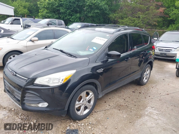 2013 Ford Escape SE with VIN 1FMCU0GX5DUB68604, listed as a IAAI auction lot 42126594 with 165,540 mi miles and . Bid and sale history available at carsss.com. Image 2.