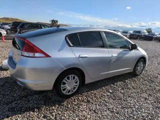2010 Honda Insight LX with VIN JHMZE2H51AS011243, listed as a Copart auction lot 54445555 with 224,722 mi miles and Salvage Title. Bid and sale history available at DreamBid. Image 3.