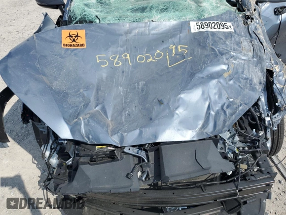 2023 Toyota Corolla Cross LE with VIN 7MUCAABG8PV066528, listed as a Copart auction lot 58902095 with 14,190 mi miles and Salvage title. Bid and sale history available at DreamBid. Image 12.