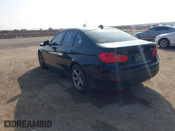 2013 BMW 3 Series 328i with VIN WBA3C1C51DF440679, listed as a IAAI auction lot 41533587 with 184,812 mi miles. Bid and sale history available at carsss.com. Image 3.